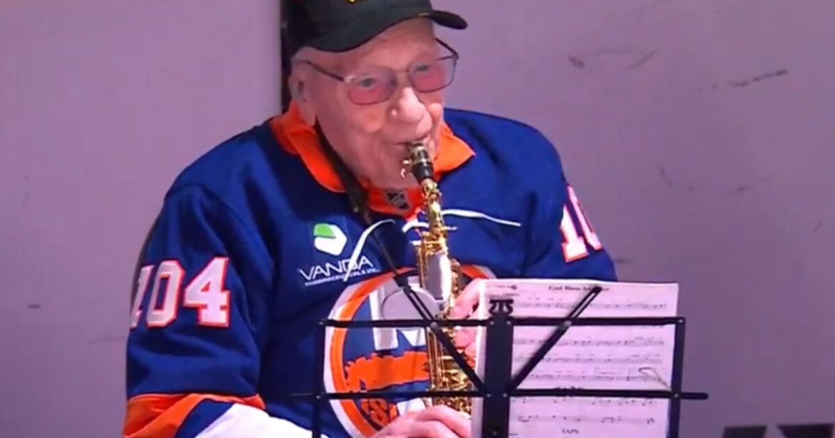 INSPIRING: 104-Year-Old WW2 Veteran Plays National Anthem on Saxophone at NHL Derby Match (VIDEO)