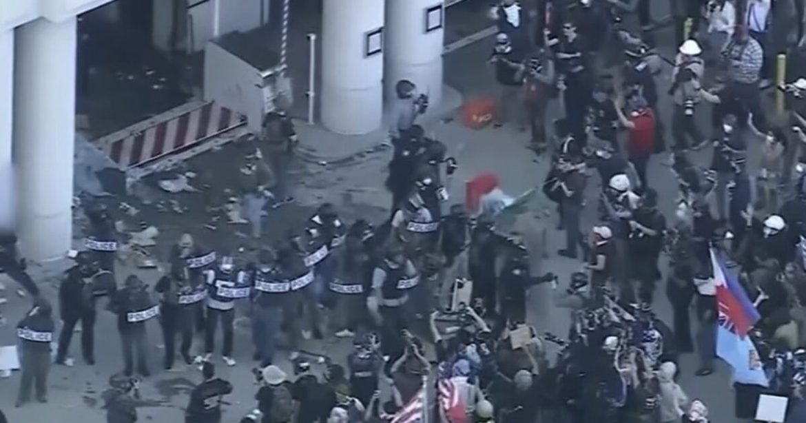 Watch: Anti-Trump Leftists Attack Local Fox Journalists, Destroy Their Equipment With Riot Police Standing 5 Feet Away