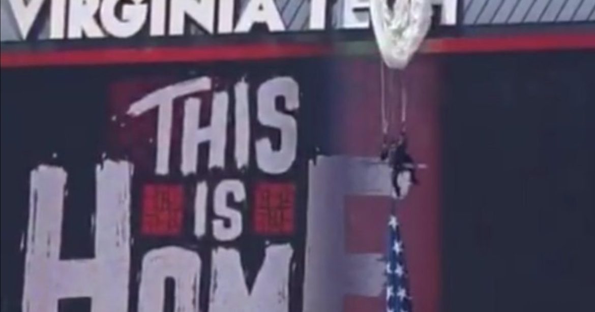 OUCH! Parachuter Crashes Into Scoreboard at Virginia Tech Game, Left Dangling Above Stadium (VIDEO)